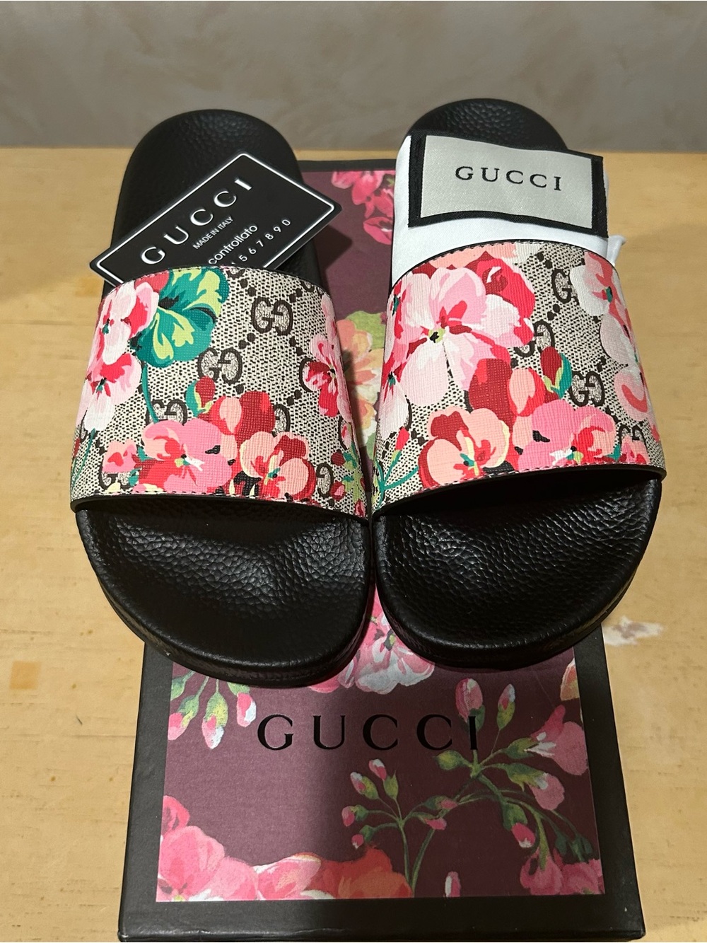 Gucci women’s GG Blooms Supreme floral slide sandals in size 38